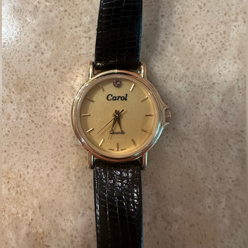 Carol Watch with black leather strap.
